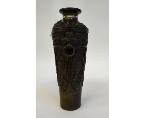 A Chinese cast bronze vase of shouldered, tapered form with a narrow neck and flared rim, decorated with stylised deer, stiff