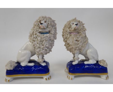 A pair of mid 19thC Chelsea porcelain model lions, each seated on a pillow&nbsp; 3.5"h