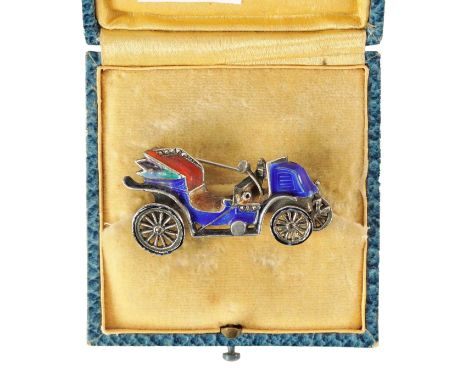 A VINTAGE SILVER ENAMEL CAR BROOCH with hinged pin and safety locking catch 4.5cm wide