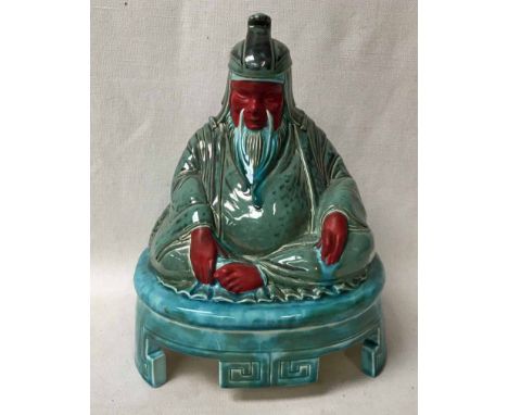 A rare Doulton &amp; Co pottery Speaker Cover as a Seated Buddha, painted in polychrome enamels, manufactured for Artandia Lt