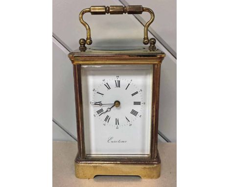 A Eurotime 20th century brass cased Carriage Clock with rectangular white enamel face, Roman numerals and Arabic figures, sig