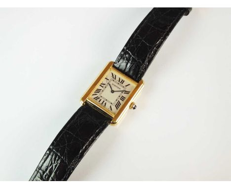 A Cartier gold plated Tank Solo quartz wristwatch, the oblong white dial with black Roman numerals, sapphire set winding crow