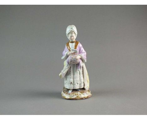 A Meissen porcelain figure of 'The Racegoers Companion'late 19th centurydressed in a lace bonnet, purple shawl and fur trim, 