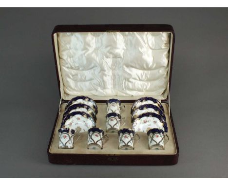 A Coalport coffee service with James Dixon & Sons silver-mountsprinted and painted with roses within blue and gilt borders, p