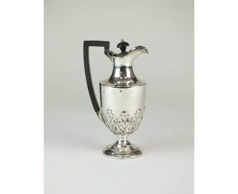 A Victorian silver hot water jug, M Bros, Chester 1896, of pedestal form with embossed acanthus leaf decoration, with ebonise