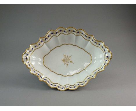 A rare and large Caughley dessert centre dishcirca 1790-93of canted oval form with an elaborately moulded lobed and cusped ri