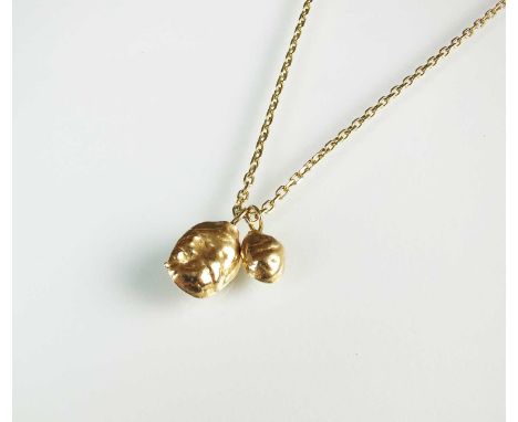 A yellow metal chain necklace, with bolt ring clasp stamped '585', suspending two cast yellow metal 'nugget' pedant drops, le
