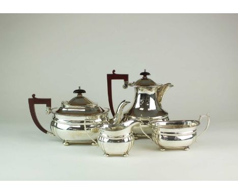 A four piece silver tea service, Adie Brothers, Chester 1938, comprising; a teapot, 15cm high, a hot water jug, 19cm high, a 