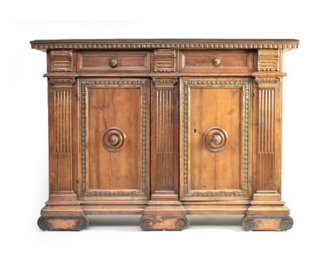 An 18th century Italian, Renaissance style, walnut cabinet, the ovolo moulded top above a dentilled frieze, over two frieze d