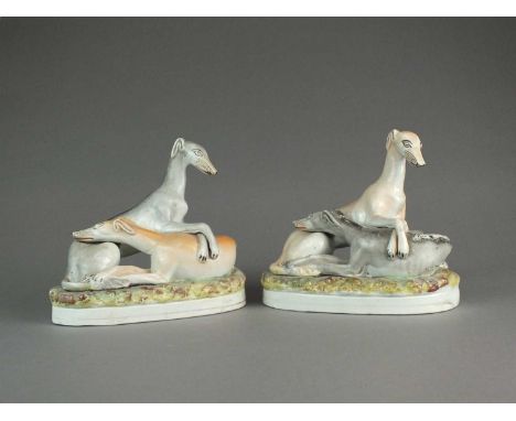 Two unusual Staffordshire Greyhound groupsmid-19th centuryeach group modelled as two greyhounds lying intertwined on oval nat