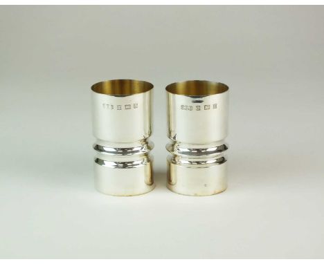 A pair of modern silver beakers, Haseler &amp; Restall, Birmingham 1971, each of cylindrical form with reeded band to the wai