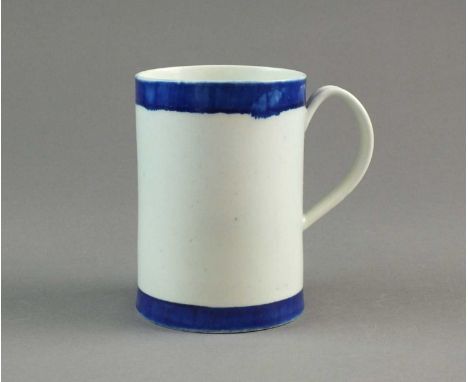 An unusual Caughley porcelain mugcirca 1780of cylindrical form with a grooved strap handle, decorated with plain blue bands t