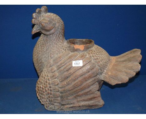 A large and heavy vintage terracotta Chicken with fine detail to feathers, etc. and opening on the rear, possibly a planter o