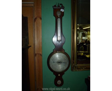 An old Mahogany cased Banjo barometer/thermometer with hygrometer and spirit level, the face with silvered finish and the ori