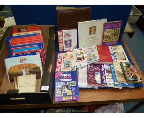 A quantity of Stanley Gibbons books on stamps and coins, 'Queen Elizabeth II,A Jubilee Portrait in Stamps' etc.