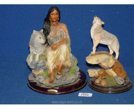 A Native American Figurine of Indian Woman and Wolf by The Juliana Collection. 9 1/2 tall. and a Howling Wolf on a tree trunk