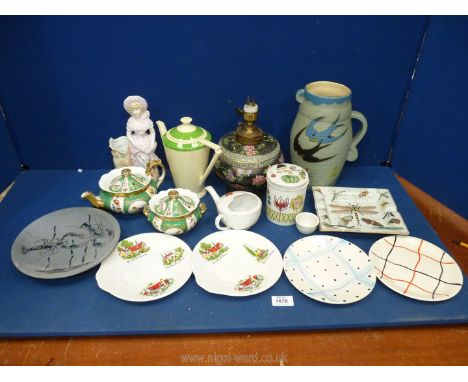 A quantity of china including green and gilded teapot and sugar bowl, Cetenware pottery vase, black floral lidded vase conver