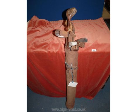 A vintage canvas and leather Golf bag containing 15 antique Hickory golf Clubs including W. Fernie Penarth Vickers immaculate