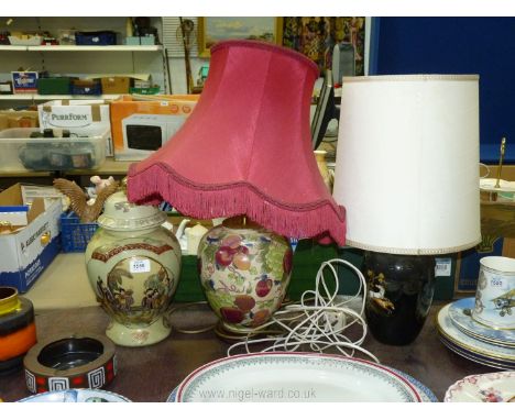 A contemporary lidded Ginger Jar, 14 1/2" tall, a ceramic table Lamp with fruit decoration and deep red shade, plus another t