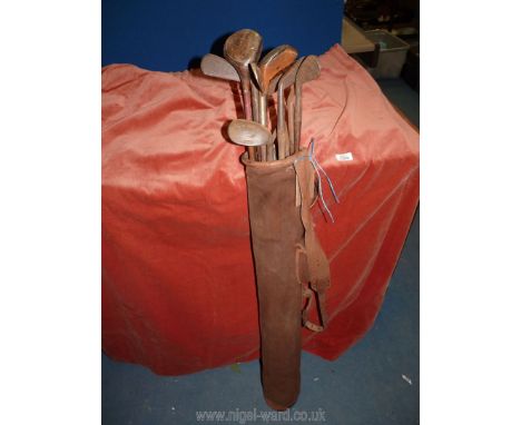 A vintage canvas and leather Golf bag containing 15 antique Hickory golf Clubs including M. Mitchell St. Andrews special.