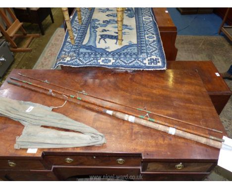 An unnamed handmade cane three piece salmon rod in vintage cloth bag.
