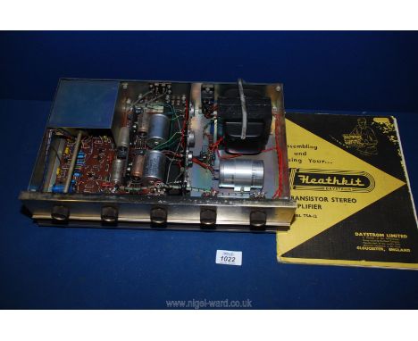 A vintage Heathkit transistor stereo amplifier model TSA-12 with original assembly and operating instruction book.
