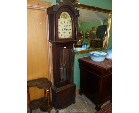 An Oak cased eight day longcase Clock, the arched painted face decorated with fruit and flowers and having Roman numerals, in