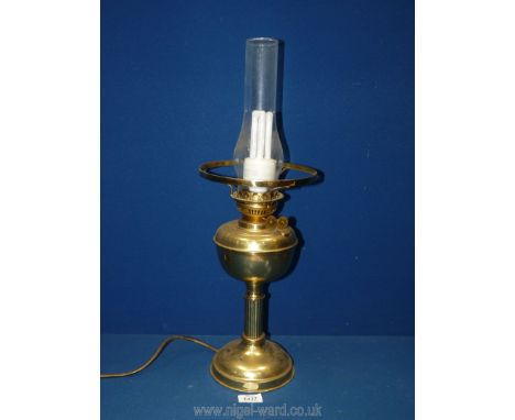A brass oil lamp converted into electric, 22" tall.