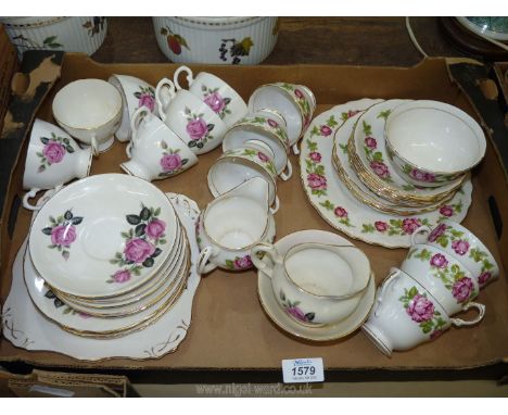 A Royal Vale part tea service with rose and leaf pattern to include; bread &amp; butter plate, jug, sugar bowl, 6 cups &amp; 