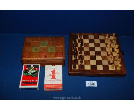 A leather gilt tooled playing card box stamped USA Lines, plus a complete Mahogany chess set and box board.
