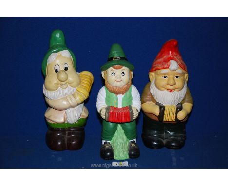 Three hand painted 20th c. ceramic garden gnomes, all approx 12" tall.