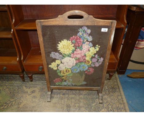 An oak framed floral tapestry Firescreen.