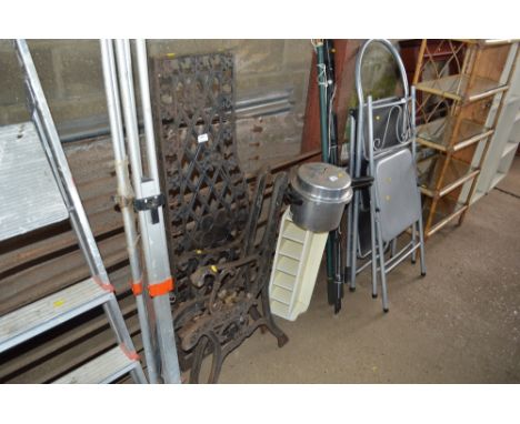A pair of metal garden bench ends and back 