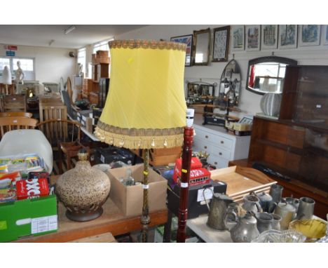 A brass standard lamp and shade 
