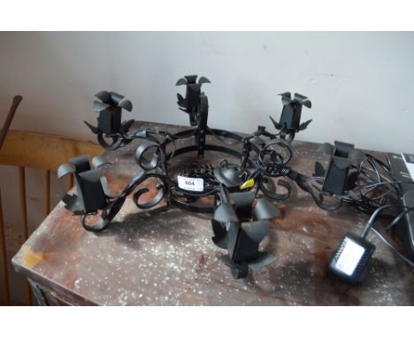 A wrought iron ceiling light 