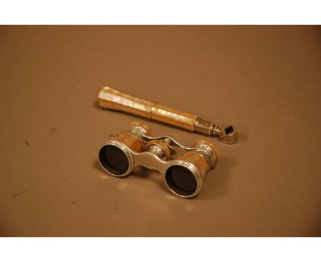 A pair of opera glasses, chromed frames with mother of pearl panels bodies, eye pieces and extending handle, in pouch (2)