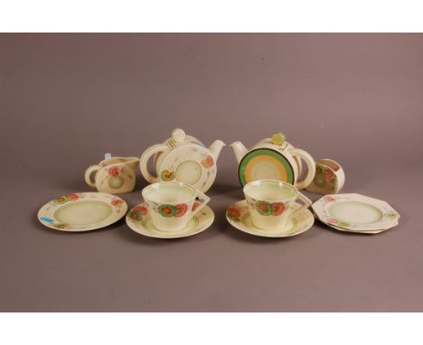 An Art Deco British pottery tete a tete tea set, probably Newport Pottery by Clarice Cliff, some pieces with no. 776243, with