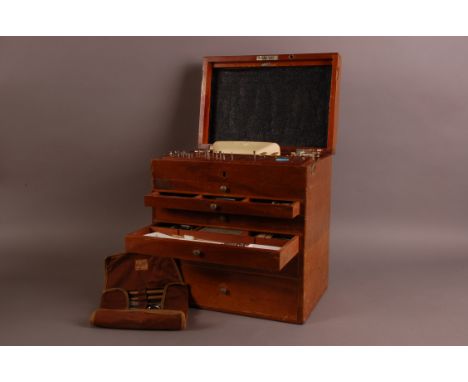 A vintage dentist's tools and equipment box, 33cm wide and 36cm high, having name plate for Raymond O'Neil, with contents, to