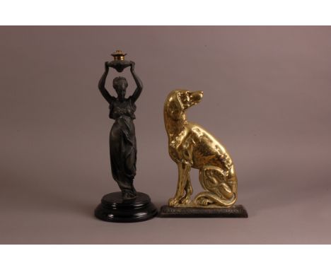 A late Victorian brass and cast iron dog door stop, 32.5cm, together with a similar period spelter figural lamp base, 42cm (2