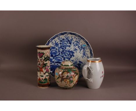 A large Japanese Arita style blue and white porcelain charger, 40cm diameter, together with a Canton style vase and ginger ja