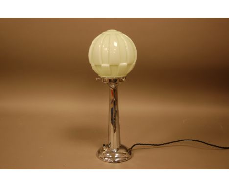 An Art Deco style table lamp, the metal column supporting a green glass shade