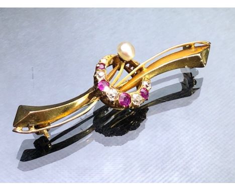 Gold (unmarked but possibly 15ct or 18ct) central Crescent with 4 Rubies and 5 Old cut Diamonds, and a button Pearl approx 5c