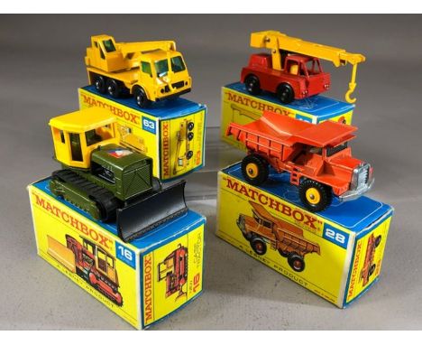 Four boxed Matchbox Series diecast model vehicles: 16 Case Tractor, 42 Iron Fairy Crane, 28 Mack Dump Truck, 63 Dodge Crane T