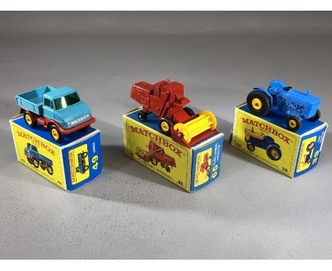 Three boxed Matchbox Series diecast model vehicles: 39 Ford Tractor, 49 Unimog, 65 Claas Combine Harvester