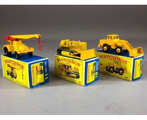 Three boxed Matchbox Series diecast model vehicles: 11 Jumbo Crane, 18 Caterpillar Bulldozer, 69 Hatra Tractor Shovel