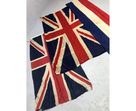 Two vintage Union Jack flags, the larger approx 205cm x 115cm, along with a further piece of red. white and blue flag materia