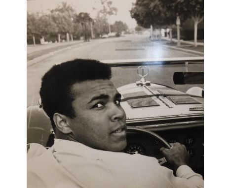 A framed and glazed page from JEFF KOONS' book "GOAT: A Tribute to Muhammad Ali" published by Taschen depicting Muhammad Ali 