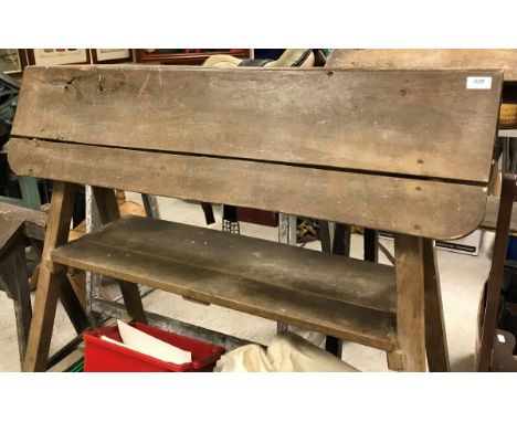 An elm saddle rack with shelf CONDITION REPORTS Height approx 119 cm. Length approx 122.5 cm.  Width approx 64 cm.