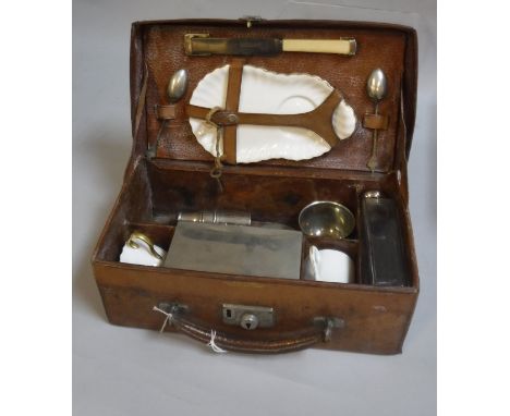 An A Barrett &amp; Sons of London leather picnic case and contents of various requisites to include flask, sandwich box, bott