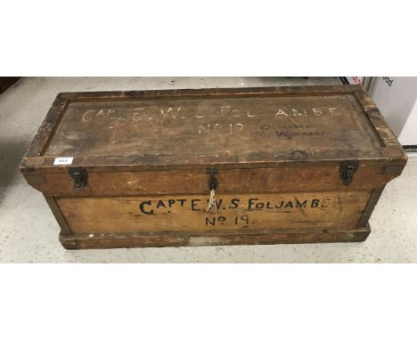 A vintage wooden trunk inscribed "Capt E.W.S. Foljambe No. 19 - Osberton Worksop"